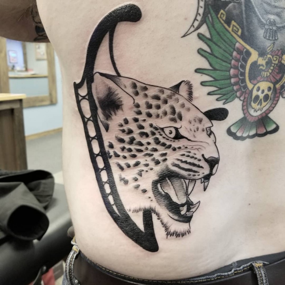 "Here Are 70+ Unique Traditional Jaguar Tattoo Ideas That Will Give Strength For Men jaguar tattoo traditional jaguar tattoo meaning black jaguar tattoo jaguar tattoo old school jaguar tattoo on hand simple jaguar tattoo small jaguar tattoo jaguar tattoo tribal jaguar tattoo chest jaguar tattoo black and grey jaguar tattoo mayan jagua hand tattoo jaguar tattoo forearm jaguar tattoo back jaguar tattoo small jaguar tattoo american traditional tattoo ideas for men strength tattoos unique tattoos"