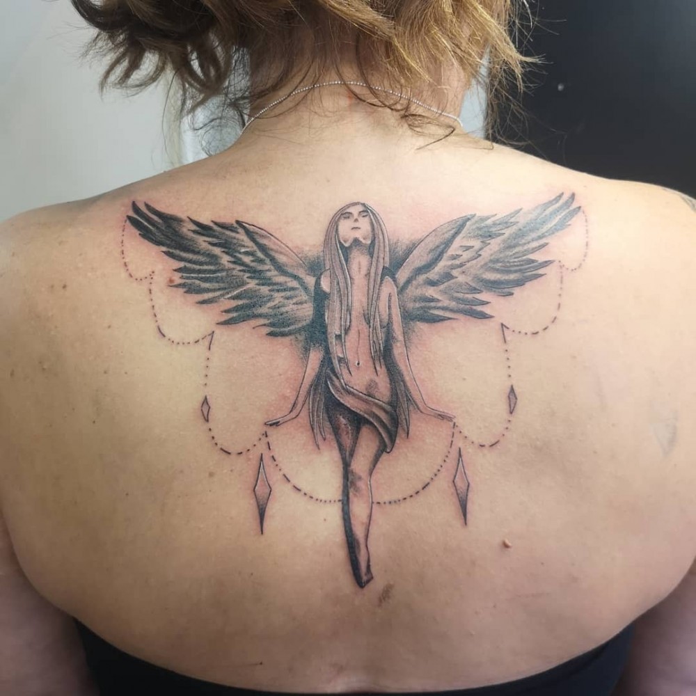 female protector guardian angel tattoo