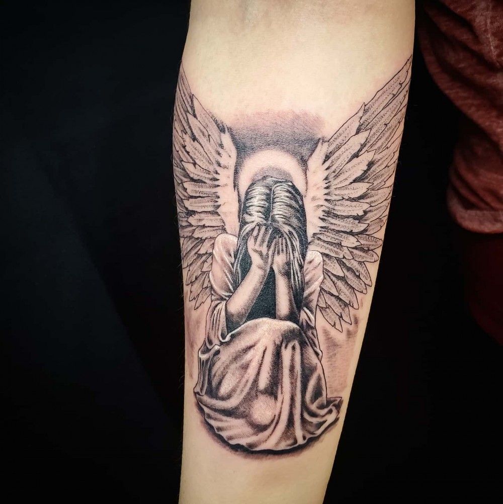 small guardian angel tattoo