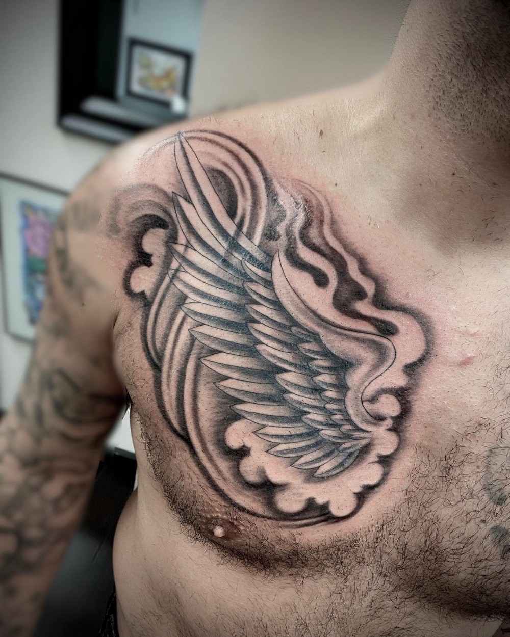 chest-angel-wing-tattoo-chris_koutsis
