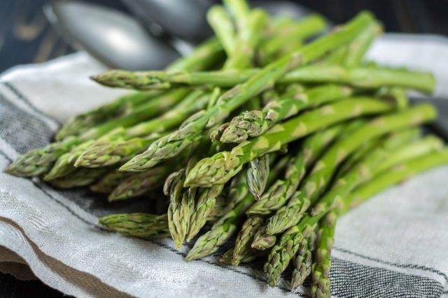 Spring season - fresh white and green asparagus on linen napkin