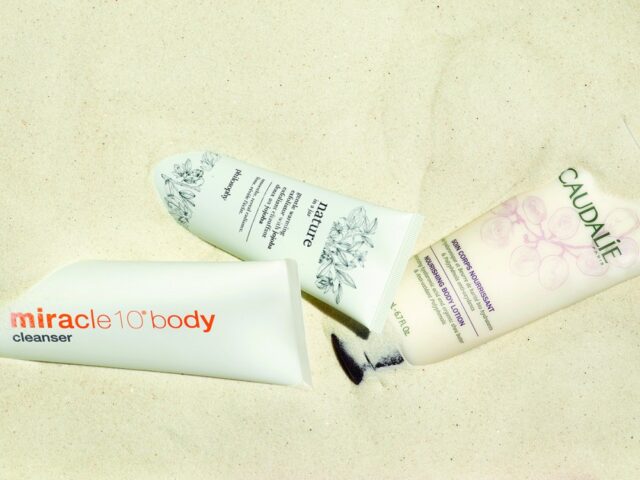 summer beauty products for skin and hair | beauty products in sand