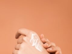 person applying hand cream
