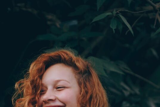 smiling woman with red hair