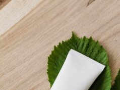 blank cosmetic tube on fresh chestnut leaf